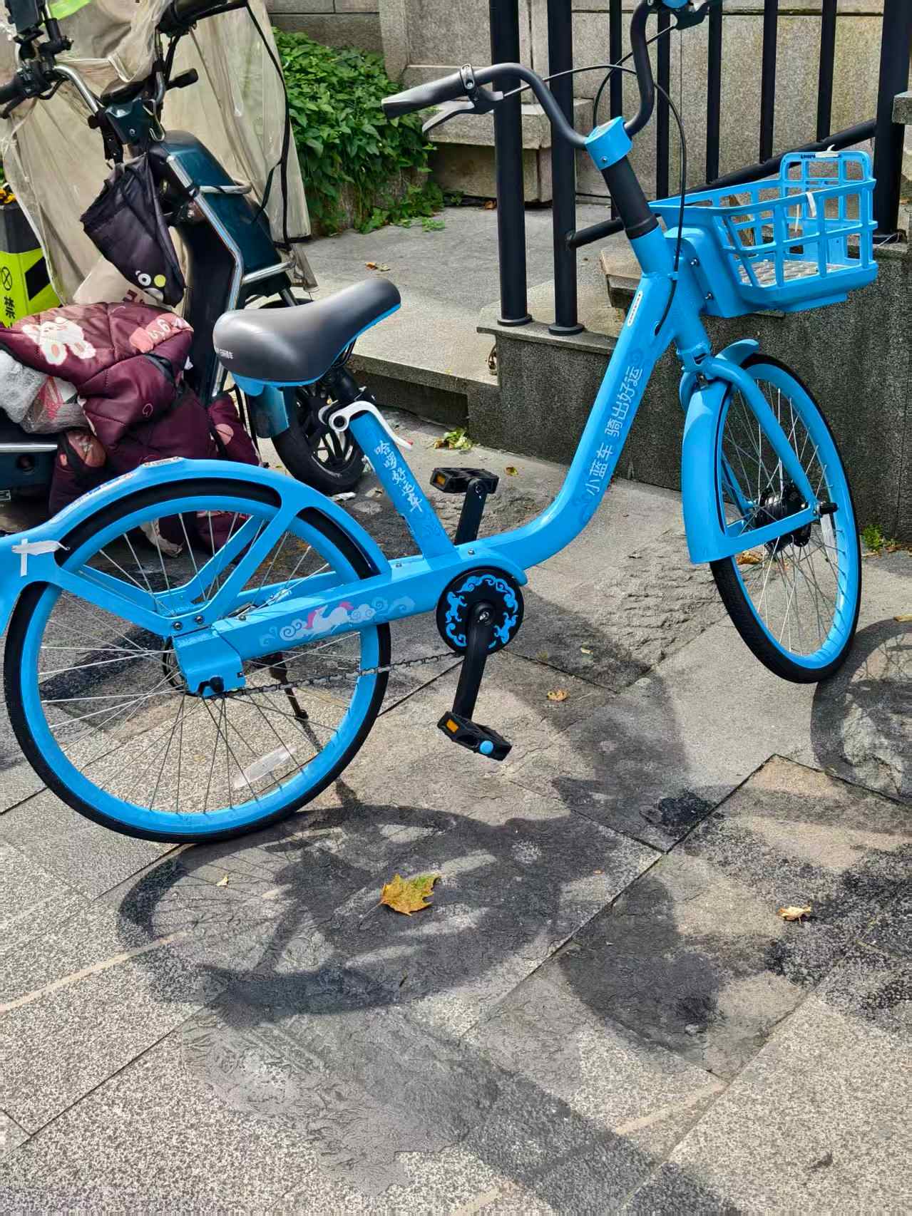 Blue Hellobike parked on a street in China