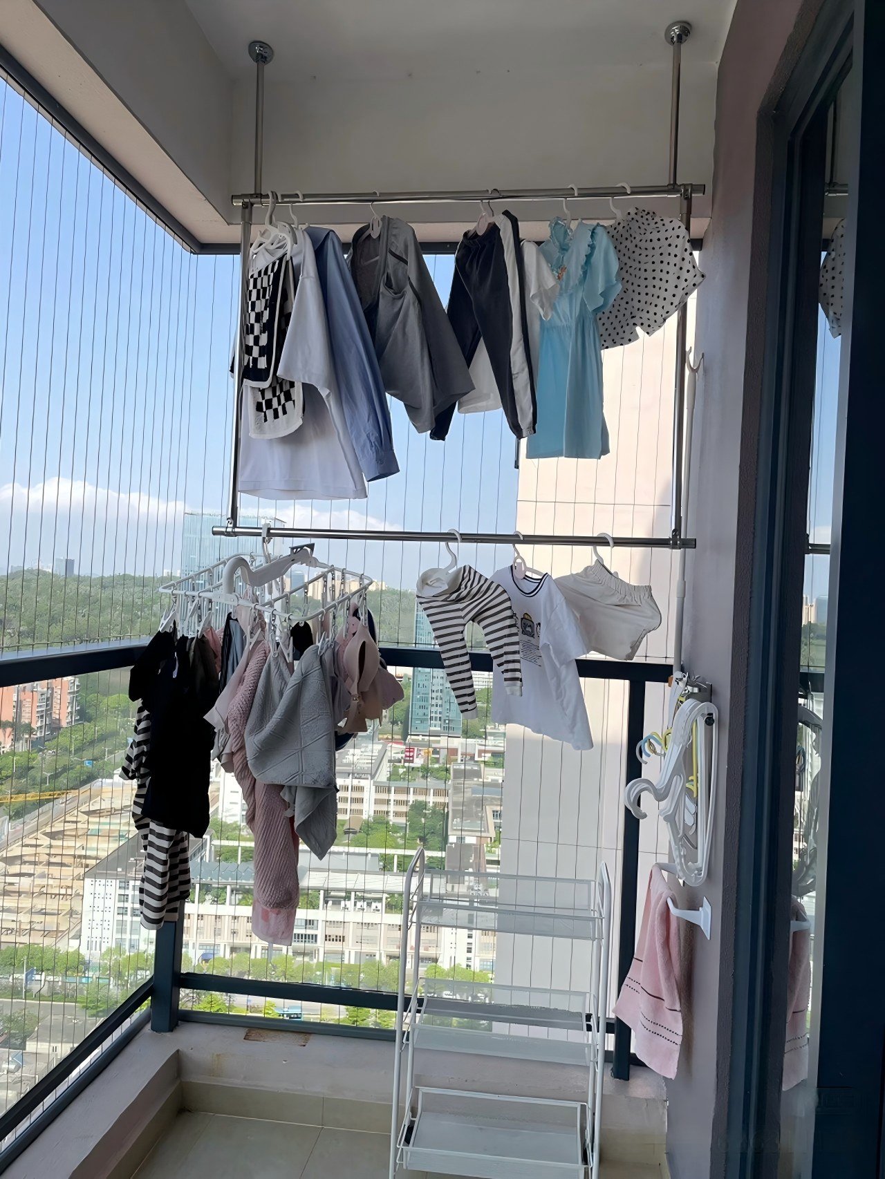 Clothes drying on balcony racks in a Chinese residential neighborhood